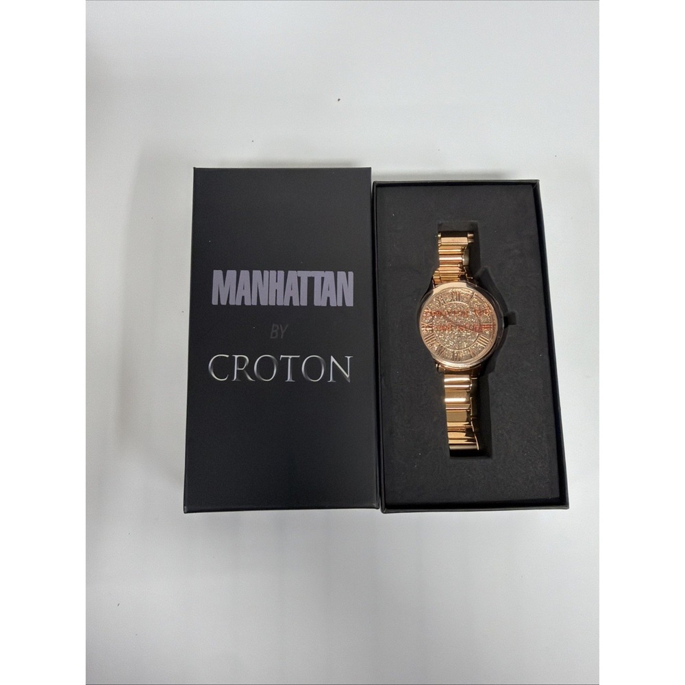 Croton Manhattan watch features a gold-tone design